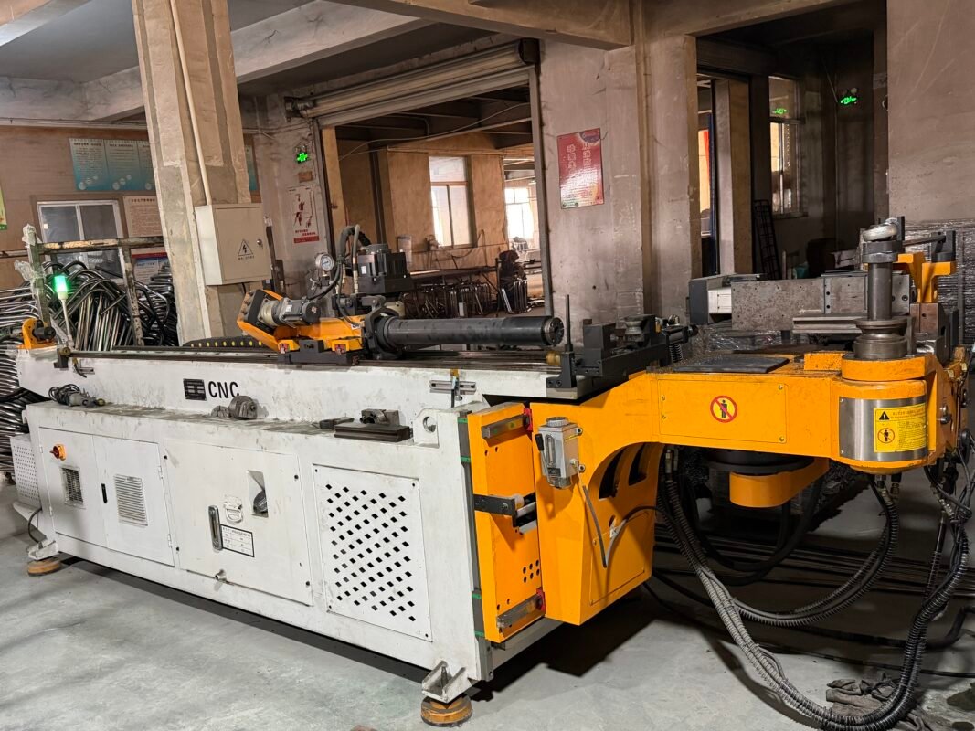 Metal frame furniture manufacturing using CNC bending for repeatable forming where bed frame parts require precision angles